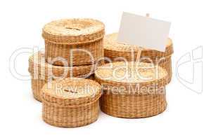 Various Sized Wicker Baskets with Blank Sign on White