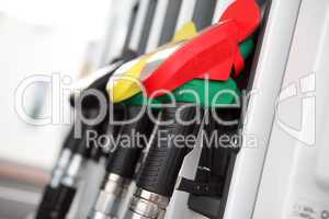 Several gasoline pump nozzles at petrol station