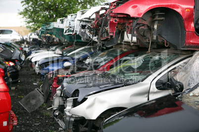 Car cementary with many broken cars