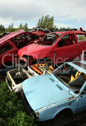 Car cementary with many broken cars