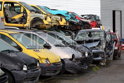 Car cementary with many broken cars