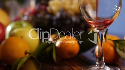 Fresh fruits and pouring wine – dolly shot