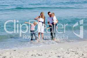 Lively family having fun at the beach