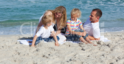 Cute little boy playing on the sand