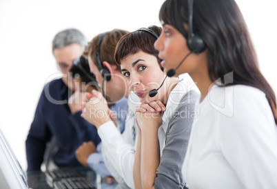 Charming businesswoman with headset on in a call center