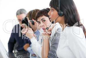 Charming businesswoman with headset on in a call center