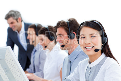 Positive business team talking on headset