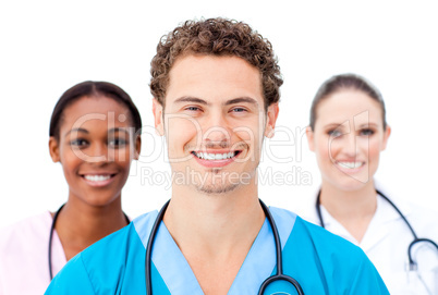 Smiling young doctors standing in a row