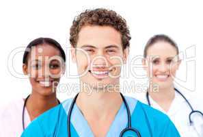 Smiling young doctors standing in a row