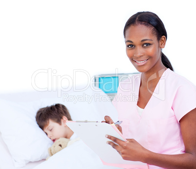 Confident doctor making notes on a patient's clipboard