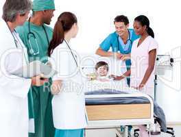 Multi-ethnic medical team taking care of a little boy