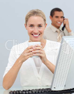 Blond woman drinking a coffee during the break