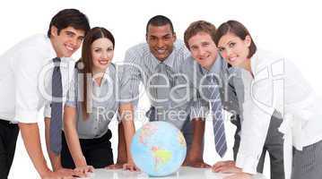 Portrait of business team around a terrestrial globe