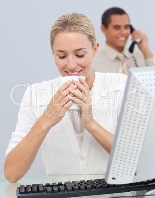 Attractive woman drinking a coffee during the break