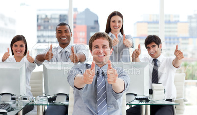 Lively business people with thumbs up