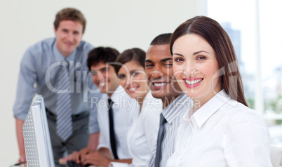 Cheerful business team working at computer