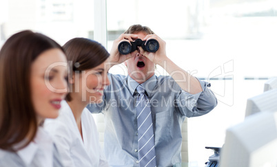 Charismatic businessman looking through binoculars