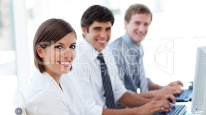 Enthusiastic business people working at computers