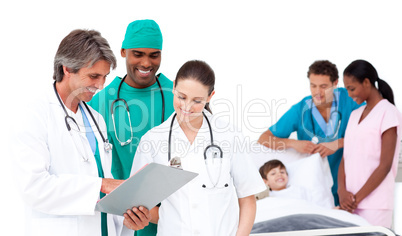 Smiling medical team in a patient's bedroom
