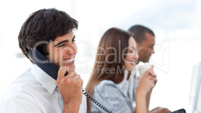 Assertive businessman talking on phone