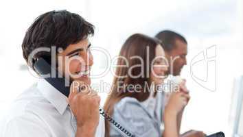 Assertive businessman talking on phone