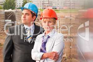 Director with subordinates on construction site