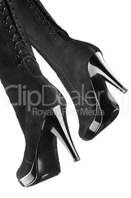 Female boots of black colour on a white background