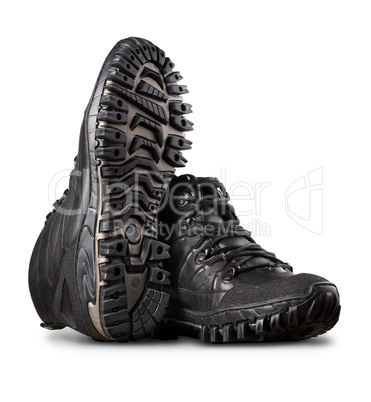 Man's winter leather boots of black color, isolated on white