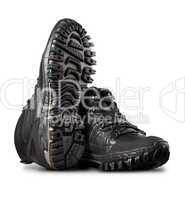 Man's winter leather boots of black color, isolated on white