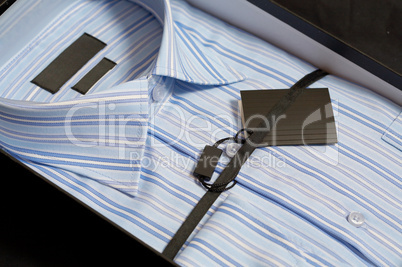 New man's shirt of blue colour in a gift box