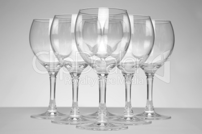 Still-life with empty glasses over white background