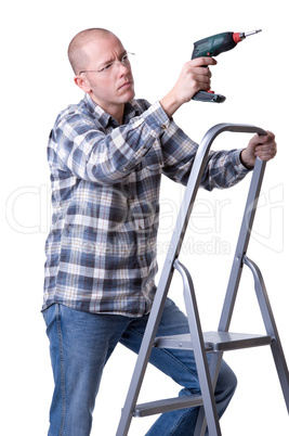 Craftsman on a ladder with a cordless screwdriver
