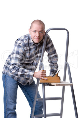 Young man with a wood plane