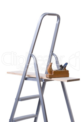 Ladder and wood plane