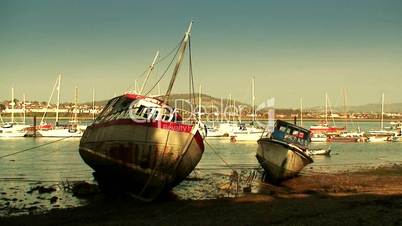 Small fishing boats at low tide