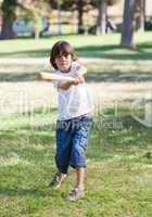 Lively little boy playing baseball