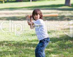Portrait of adorable child playing baseball