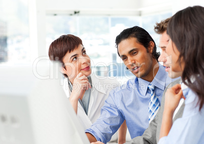 Successful businessteam working at a computer