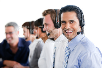 Smiling business people working in a call center