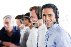 Smiling business people working in a call center