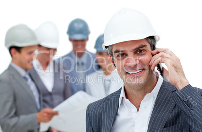 Smiling male architect on phone standing