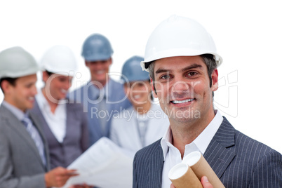 Charismatic male architect on phone in front of his team