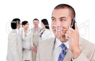 Positive businessman talking on phone