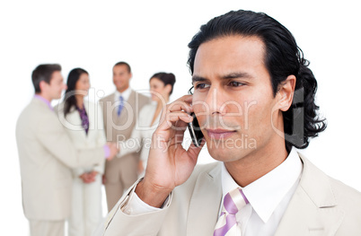 Serious businessman talking on phone