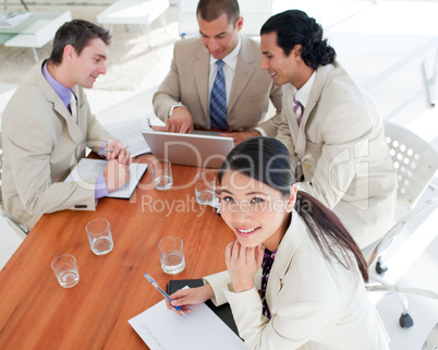 Smiling Asian businesswoman in a meeting