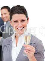 Charming businesswoman toasting with Champagne
