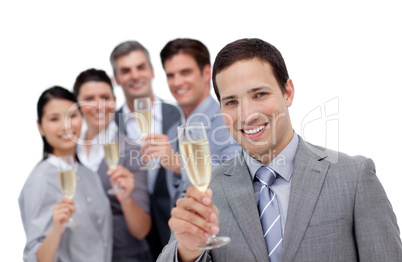 Cheerful business team toasting with Champagne