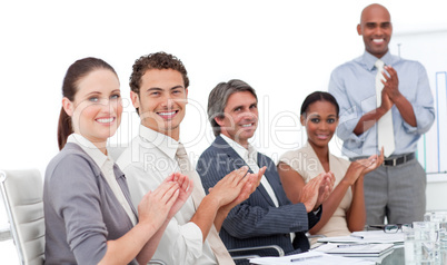 Assertive business people clapping a good presentation