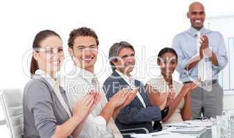 Assertive business people clapping a good presentation