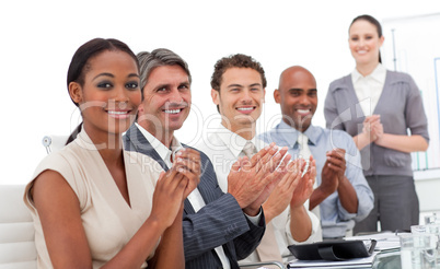Positive business team applauding a good presentation